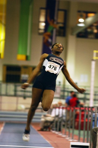 Candace Perry Fairer completes a long jump attempt during a meet in 2005. Fairer is one of the six inductees into this year’s athletic hall of fame. 