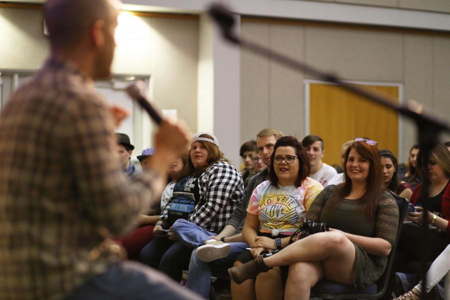 Aaron Moore, a licensed mental health counselor, talks to Erin Gillingham, founder of the To Write Love on Her Arms university chapter at USI, and Robbillie Stevenson, the previous president of the chapter, after speaking at the organization’s event Tuesday in Carter Hall. 