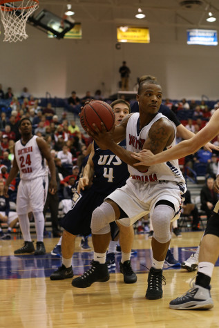 Junior guard Bobo Drummond  looks to make a pass during the final half of the men's basketball game against the University of Illinois Springfield Saturday at the Physical Activities Center . The Eagles beat the Prairie Stars 85-64.