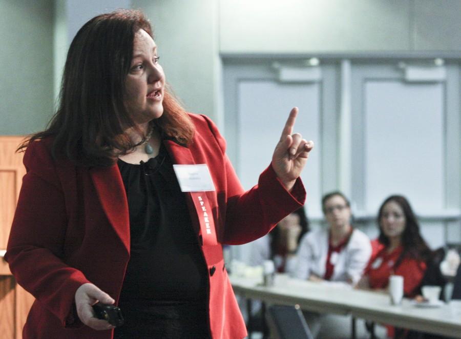 Patient rights advocate and speaker Regina Holliday shares her story at the first Health Informatics Tri-State Summit in 2014. Summit chairperson Gabriela Mustata Wilson said she looks for “powerful patient stories” when selecting conference speakers.