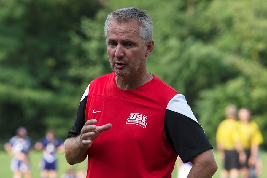 Eric Schoenstein, the newly appointed head coach of women’s soccer, talks to players last year during a game. Schoenstein spent two years as assistant coach before he was hired to replace former head coach Krissy Engelbrecht. 