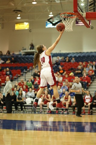 Tanner Marcum, a junior guard, shoots a layup after stealing the ball in the last moments of the second quarter of the women’s basketball game at the PAC Thursday. The Eagles beat Maryville University 74-61.  