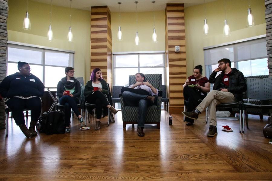 Students gather around Tim Wise, a nationally renowned anti-racist writer and educator, during a private coffee hour that gave students a safe place to ask questions on the topics of racism and discrimination in Tradition’s Lounge on Thursday. Wise served as the keynote speaker for a series of events commemorating Nelson Mandela.