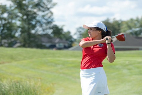 Senior golfer, Anastasia Carter watches to see where the ball will land. The women's golf team finished third in the Perry Park Spring Fling.