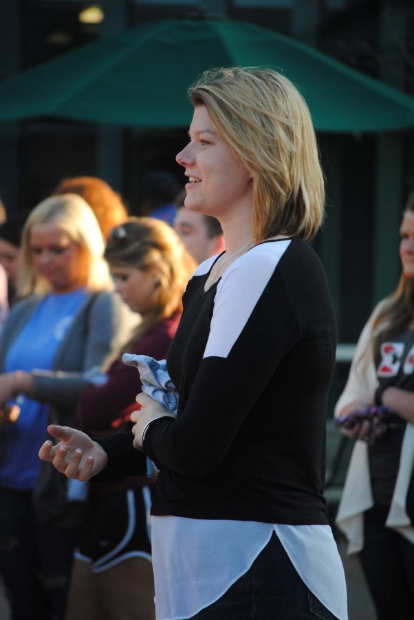 Incoming SGA President Ashley Wright listens as speakers wrap up the Walk a Mile In Her Shoes event Tuesday at the University Center Amphitheatre. Wright will be inaugurated April 14.