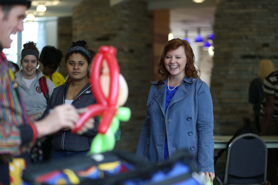 Instructor in the Intensive English Program Lisa Chamberlin gets a first look at “The Little Mermaid” inspired balloon art made by Flower Clown of the Something Fun and Different Entertainment Company Wednesday in University Center East. Balloon artists were one of the first attractions to kick off the annual SpringFest celebration.