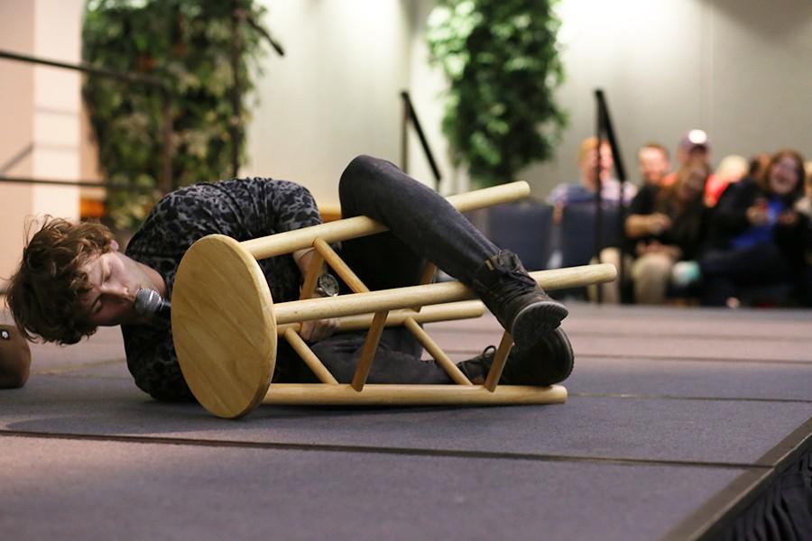 Comedian and previous "America's Got Talent" contestant Drew Lynch purrs as he straddles a stool acting as a cat during his performance Wednesday in Carter Hall. Lynch's performance was one of the many events happening on campus for the annual Spring Fest celebration. 