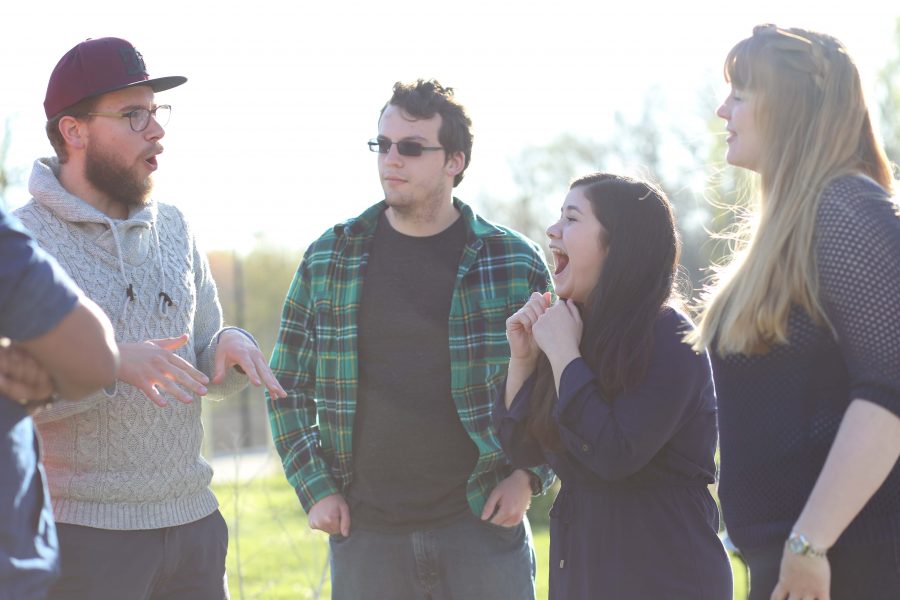 (Right to left) German international student Tim Haverkock jokes around with freshman history major Logan Tedrow, Paraguayan international student Sandrita Sanabria and German international student Sandra Quest Tuesday by Reflection Lake. Many international students will head back to their home countries after this semester. Sanabria wanted to get her friends together before they part ways. 