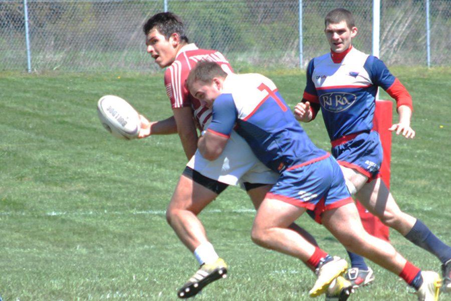 Flanker Ray Van tackles a member of the Indiana University rugby team during a game Saturday on the USI rugby pitch. USI’s rugby team will compete in nationals April 30 and May 1 in Colorado. 