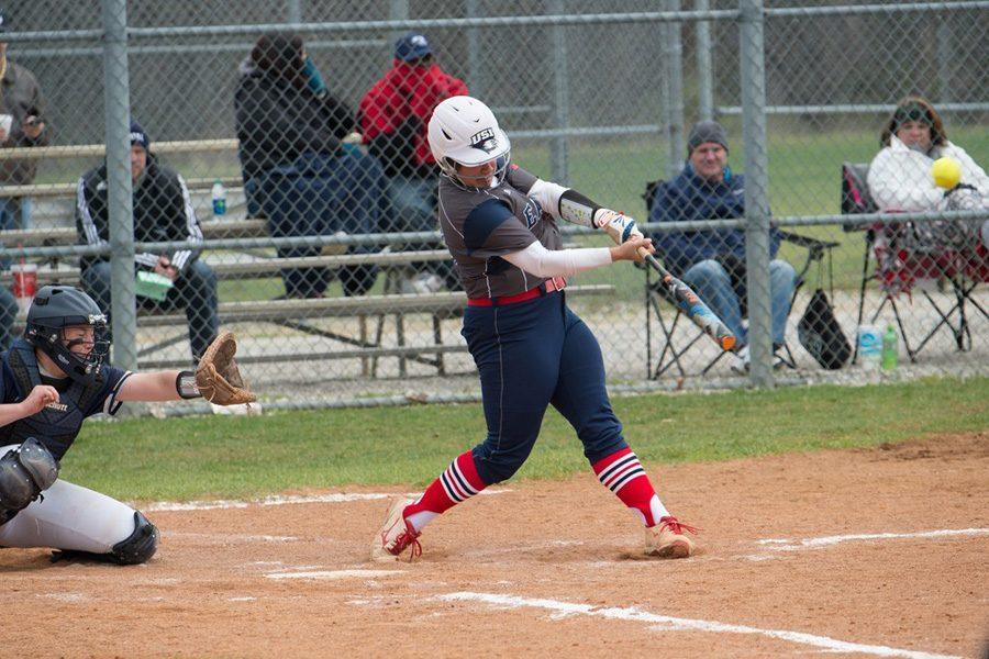 Junior pitcher/infielder Haley Hodges steps into her swing during the team’s double header against the University of Illinois-Springfield March 25. Hodges recently became the softball player with the most single-season home runs in USI history.