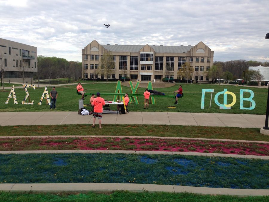 Lambda Chi Alpha sets up a table to advertise for the annual Teeter Totter event last spring. The fraternity draws interest to the actual fundraising event on Green River Road.