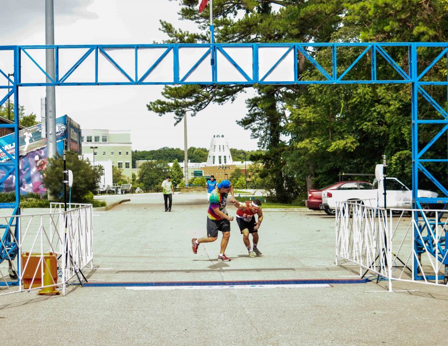Zach Price and Leo Scheller cross the finish line of the Inaugural Phi-K. The race was both a 5k and a one mile walk and all of the proceeds went toward funding research for ALS.