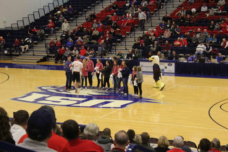 Students gather around the court Thursday evening during the Craziest fan contest. Sigma Tau won the Craziest fan contest for organization and Andrew McGuire won for the single person.