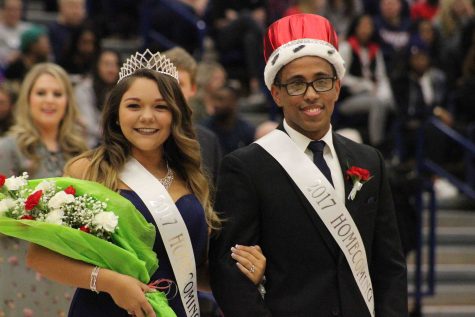 Virgilio Paulino a junior political science and philosophy major with a pre-law minor stands with Angela DaCosta, a junior biology (pre-medicine) major after they won Homecoming King and Queen Saturday afternoon in the PAC.