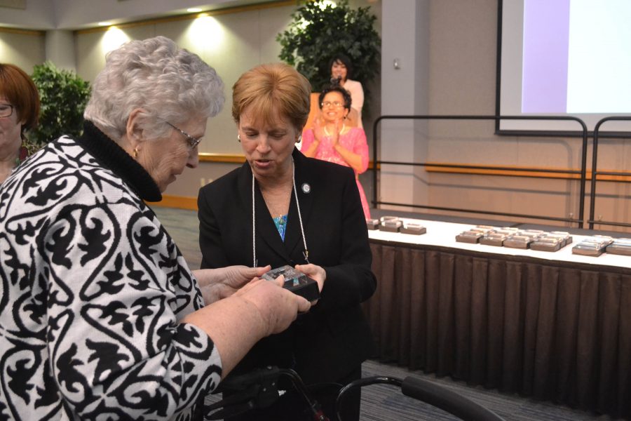 Marcia Kiessling, associate provost for Student Affairs and Betty Rice, wife of former university president David Rice, admire Rice’s award at the 2015 Phenomenal Women Ceremony. Rice helped link the university to the rest of the Evansville community and would plan and hosts events on the campus during her time here. 