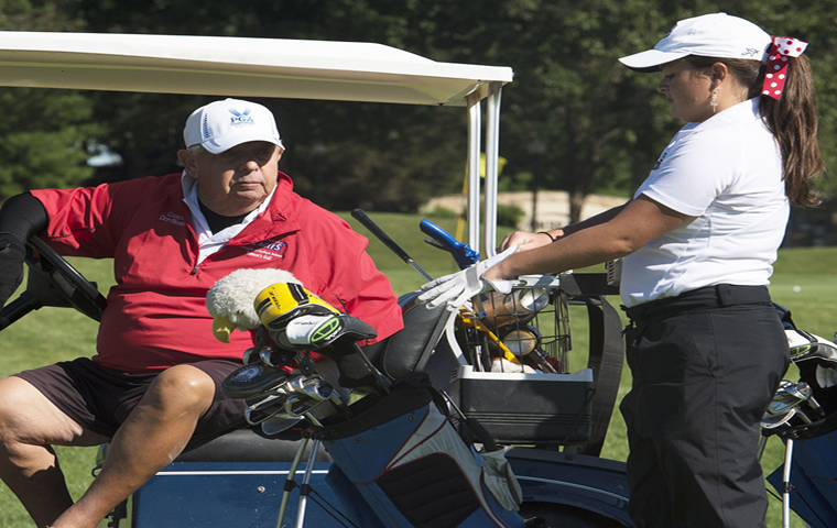 Golf scramble honors coach