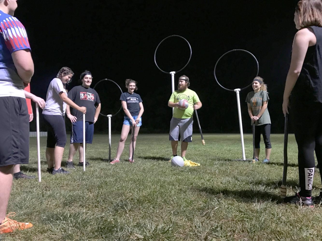 University alumnus Cole Musgrave, center, coach of the Quidditch team, goes over the rules of the game with new team members during the first practice of the year at the University of Southern Indiana (USI), Aug. 31, 2017. Quidditch is a sport created by author J.K. Rowling in the popular ‘Harry Potter’ book series. USI adopted the sport in 2011 by Amber Lynn-Seibert and Lauren Maurer.