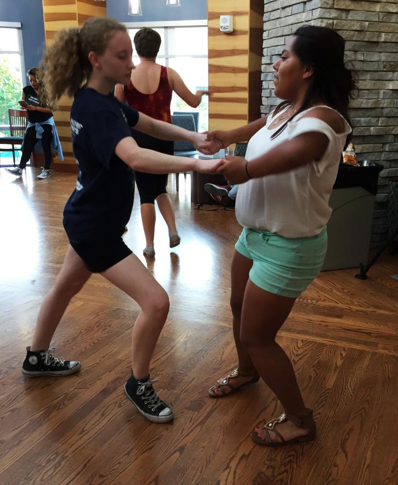 Ariel Palermo, freshman theater arts major and Daniella Silba, frehsman Spanish major perform a salsa duo at Latin Dance Night Wednesday evening. 