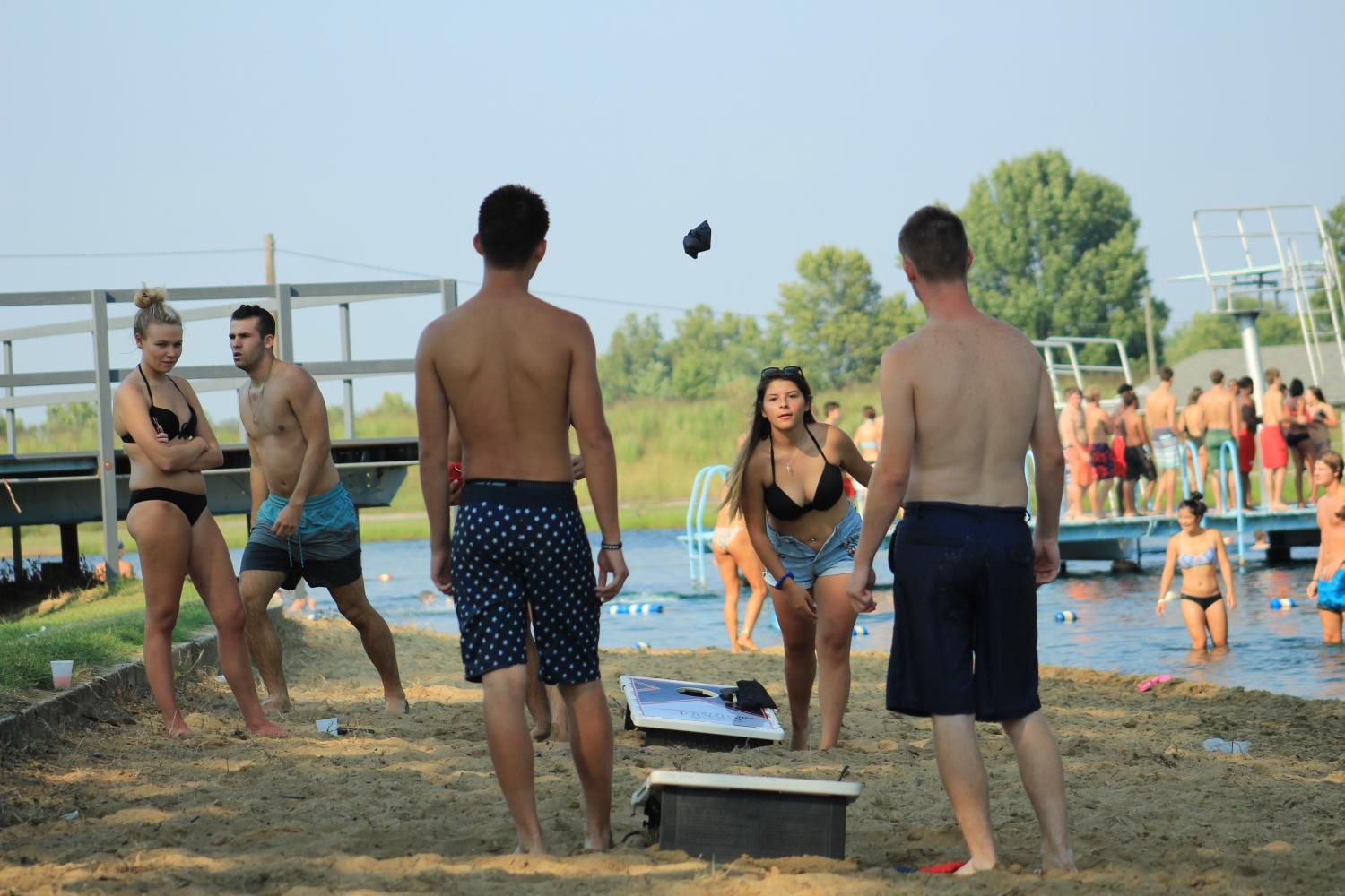 Students blasted music from a single speaker as they played game after game of Cornhole at Labor Day at the Lake Monday afternoon. Students enjoyed a variety of other games such as beach volleyball and soccer.  