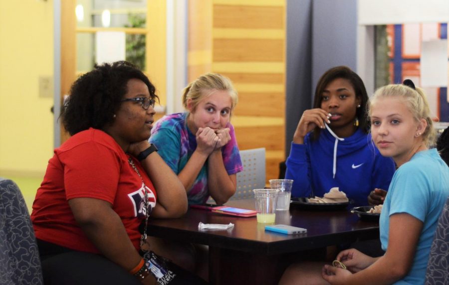 From left to right: Kylee Jackson, freshman sonography major, Lexie Fifer, freshman chemistry major, Alexa Humphrey, freshman elementary education major and Libby Fifer, a student at North Posey High School, sit around their table during Trivia Night Thursday evening in the Traditions Lounge. The team ended up getting first place by answer 66 out of 100 questions correctly.