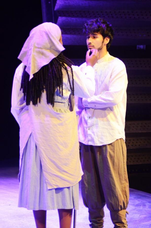 Jason Merslich (right) and Jesmelie Williams (left) practice their mother and son scene during dress rehearsal for Anon(ymous) Monday afternoon. Merslich plays Anon, a refugee trying to find his place in America, in the departments fall play.  