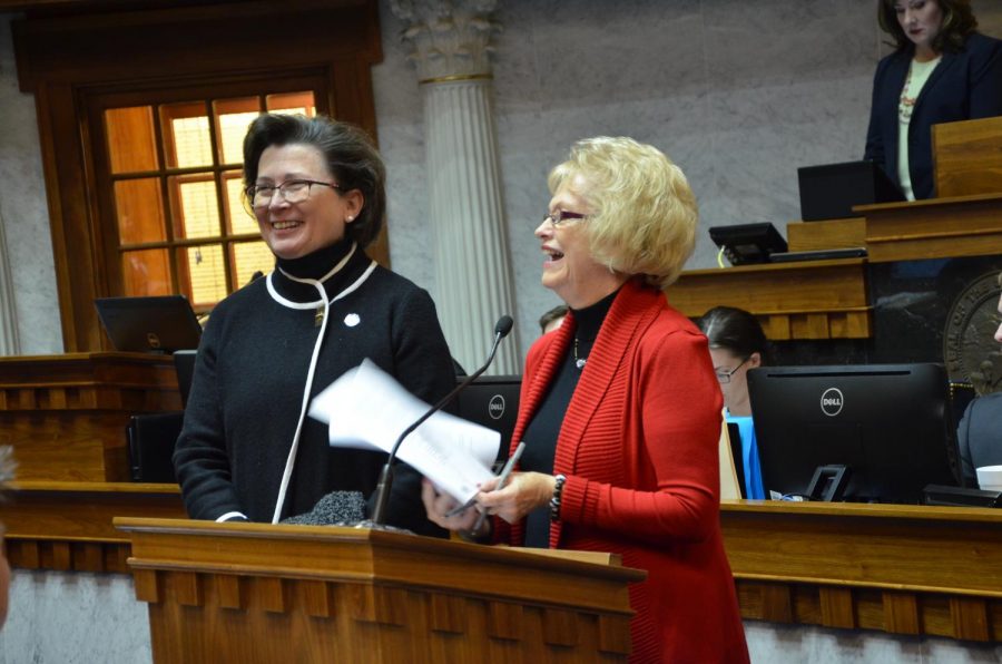 State senator Vaneta Becker (R-right) honors President Linda Bennett (left) with a resolution Feb. 12.