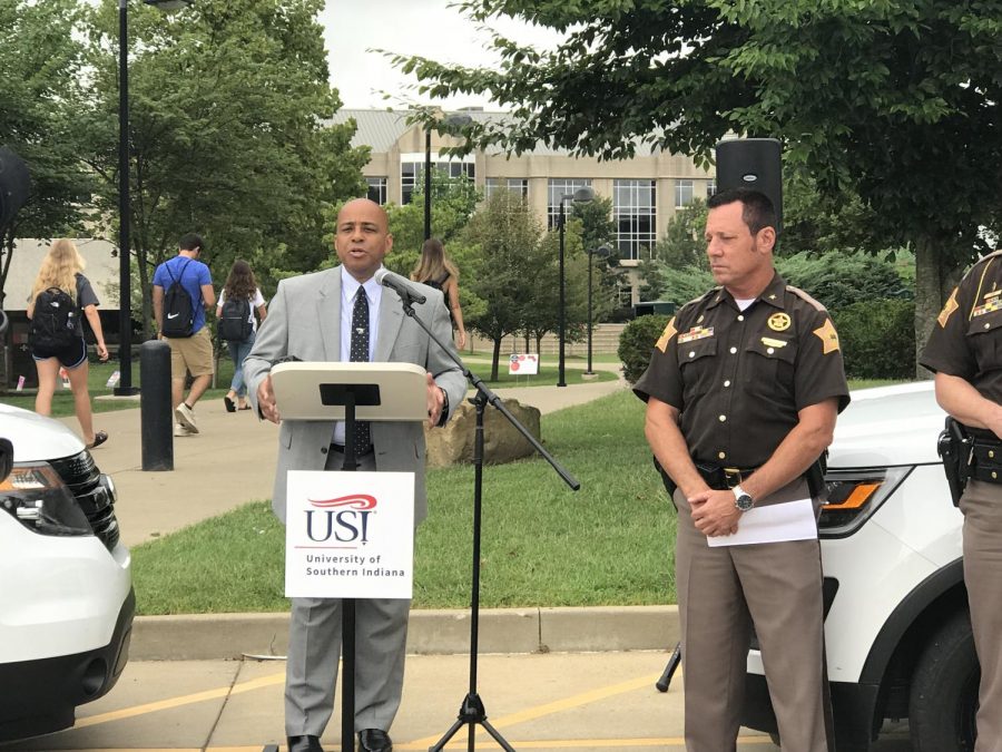 University President Ron Rochon (left), and Vanderburgh County Sheriff Dave Wedding (right) greet members of the media outside Rice Library Aug. 21 to formally announce a USI-VCSO security partnership.