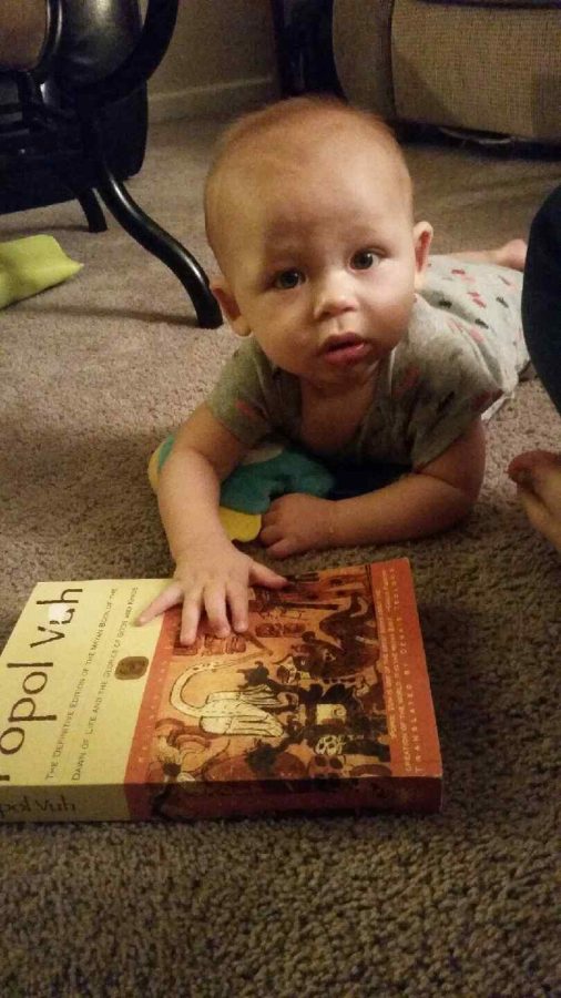 Everett is pictured with Ryker's World Mythology book. Ryker says she often reads her textbooks to Everett while she is doing her homework. 