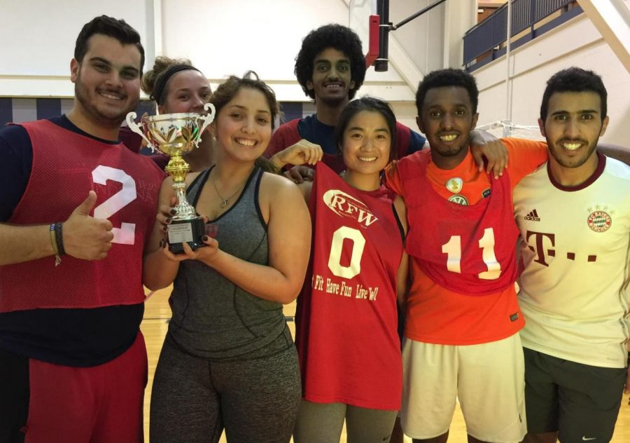 Students celebrate their win during the African Cultures Club Futsal Soccer Tournament Thursday evening. 
