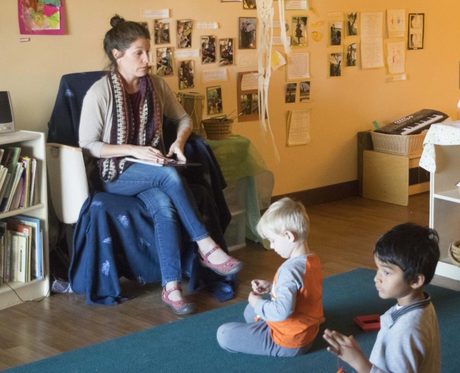 Children at the USI Children's Learning Center wait patiently for story time. 