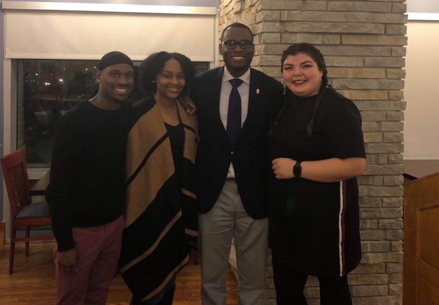 Kassie Santos (right), D’Angelo Taylor (middle right), Ta’Meia Burleigh (middle left), and Clifton Jett (left) smile after the Black History Month Oratorical Competition. 
