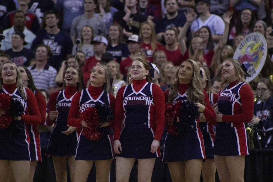 The USI Cheerleading team looks up at the jumbo Tron during a media time out.