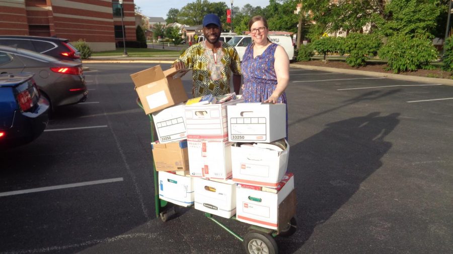 Ibrahima Yaro, a public administration graduate student and Dawn Winters, a director of academics for English as a Second Language and part-time English faculty at Western Kentucky University, collect books for the drive.