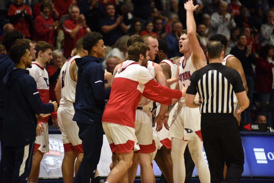 The USI Men’s basketball team celebrates after taking the lead during a timeout against Kentucky Wesleyan College Monday night at the Screaming Eagles Arena.