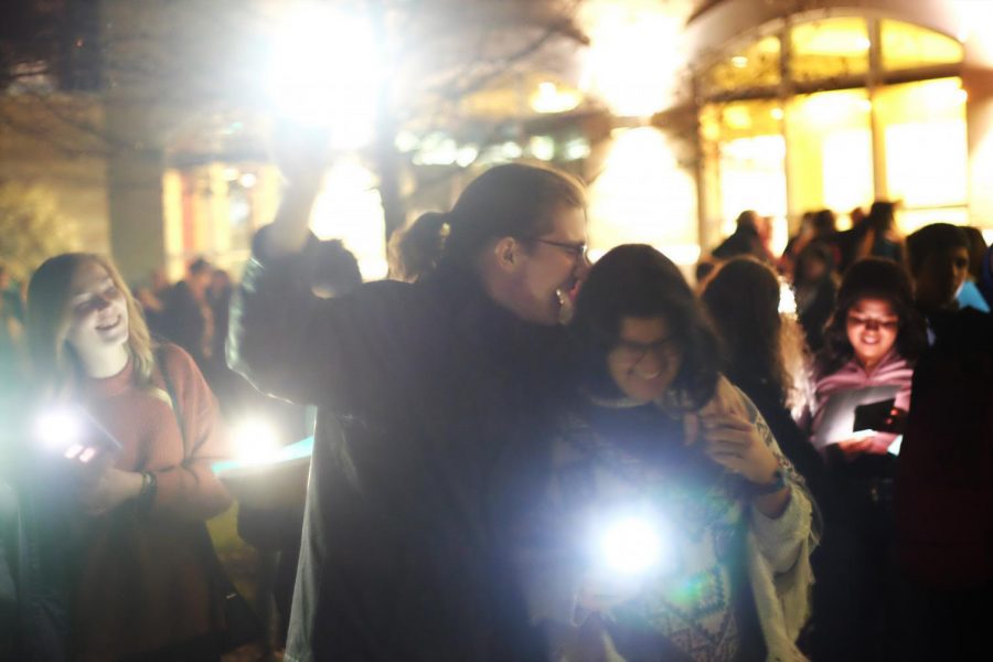 With phone light to guide them, Junior Political Science major Garett Smith counts down the seconds to the lighting of the quad with his girlfriend Freshman Biology major Ashley Arauz.