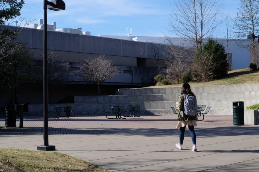 A student walks towards the University Center.