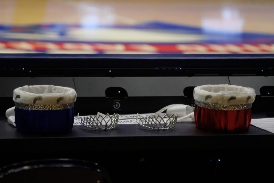 The 2021 homecoming crowns and sashes on a table in The Screaming Eagles Arena