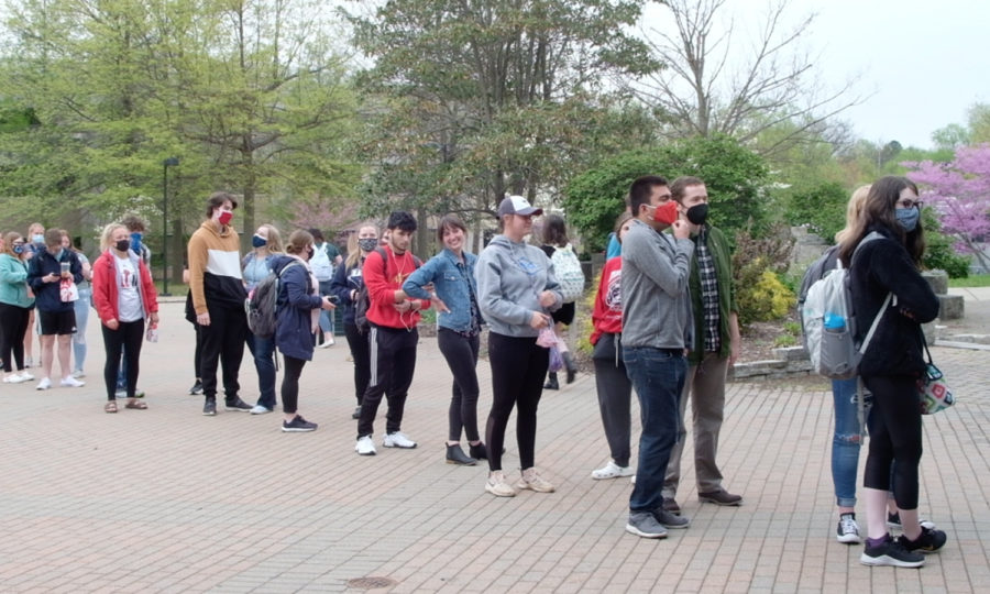 Students line up for free T-shirts outside the University Center Breezeway on April 14. It was the first event that started the campus-wide festival. 