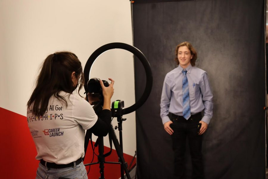 Blake Hail, junior business major, gets his headshot taken outside the gym in the Screaming Eagles Complex Wednesday. Attendees were able to get their headshots taken for free at the event.