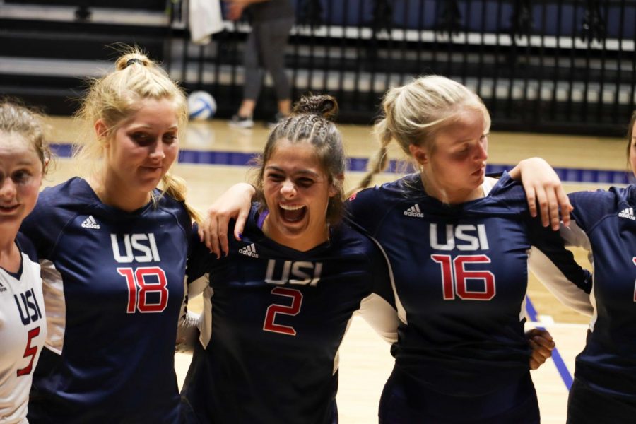 The+womens+volleyball+team+huddles+and+cheers+after+winning+the+second+set+Thursday+night+in+the+home+invitational.+After+the+huddle%2C+the+team+won+the+third+set+25-13+defeating+the+University+of+Alabama+3-0.+