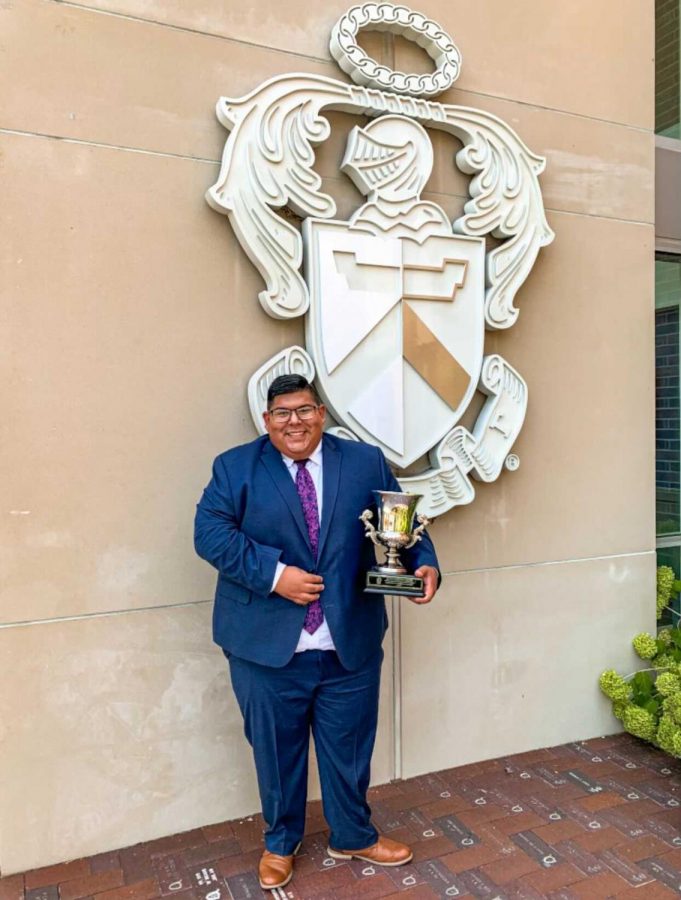Hairo Rivas, president of Sigma Tau Gamma, accepts the Edward H. McCune Award in September 2021 in Indianapolis, Indiana. The univeristy chatper of Sigma Tau Gamma won the national award for the work they did during the 2020-2021 academic year. 