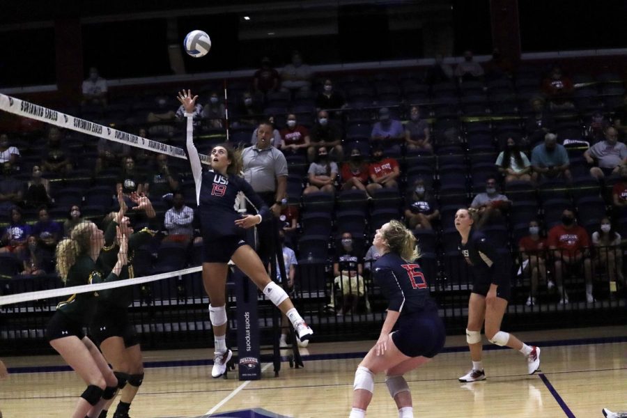 Casey Cepicky, senior setter, jumps for the ball Saturday. Cepicky had 36 assists in Saturdays game helping the team defeat Wayne State University 3-0.