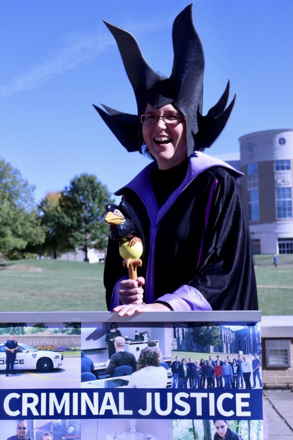 Melissa Stacer, professor of criminal justice Studies, smiles at the criminal justice table in her Maleficent costume.