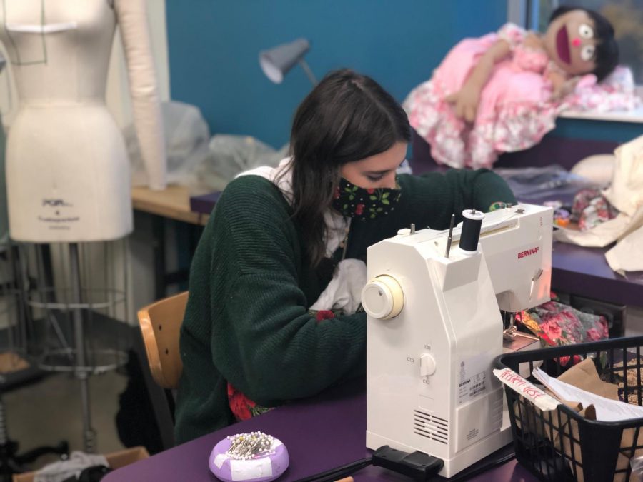Evelyn Pigman working on the costume for The Ghost of Christmas Present. “A Christmas Carol” is USI Theatre’s first large scale in-person production since COVID-19.