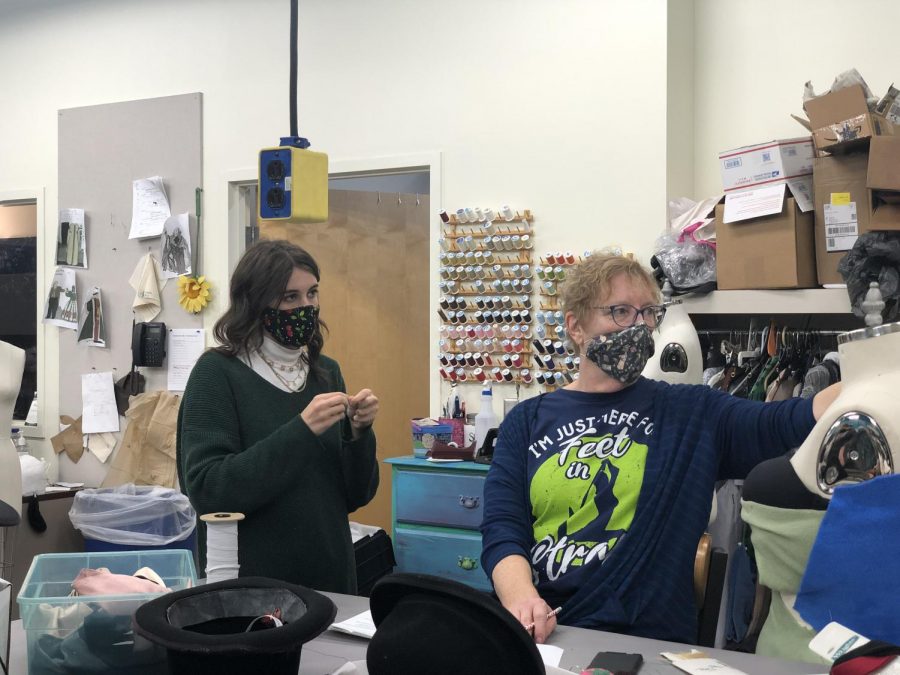 Shan Jensen working with Evelyn Pigman in the costume shop. “A Christmas Carol” is USI Theatre’s first large scale in-person production since COVID-19.