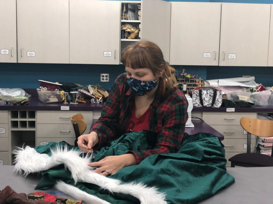 Kim Coleman working on the robe for the Ghost of Christmas Present costume. “A Christmas Carol” is USI Theatre’s first large scale in-person production since COVID-19.