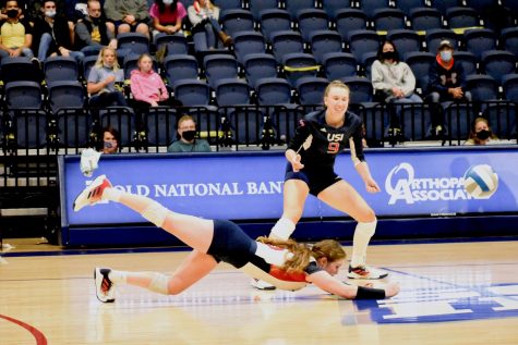 Callie Gubera, senior libero, dives for the ball Saturday afternoon. Gubera had 24 digs in the match against Dury. 