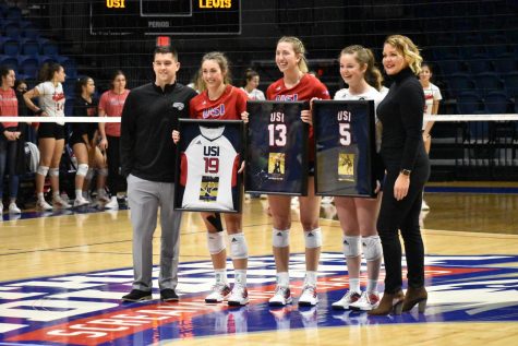 Casey Cepicky, Sidney Hegg, Callie Gubera hold their framed jerseys commemorating their time with the Womens Volleyball Team. 
