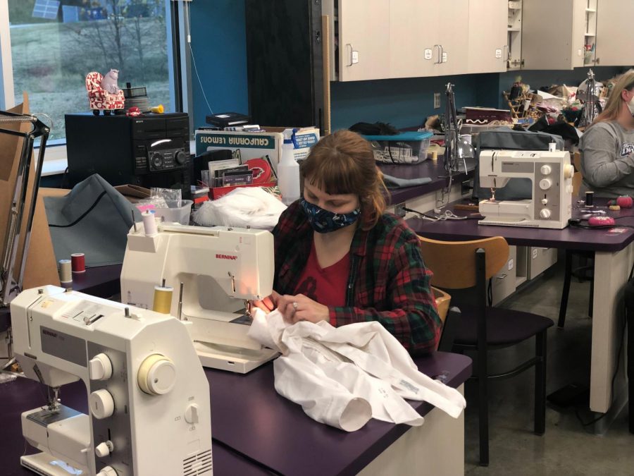 Kim Coleman sewing a costume just days before opening night. “A Christmas Carol” is USI Theatre’s first large scale in-person production since COVID-19.