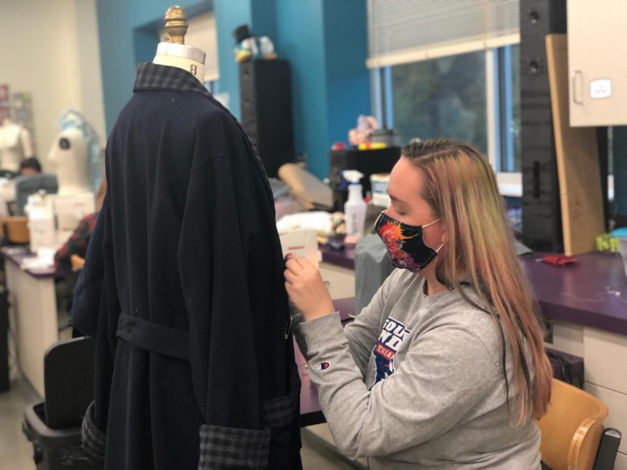 Alisha Glover working on the costume for Scrooge. “A Christmas Carol” is USI Theatre’s first large scale in-person production since COVID-19.
